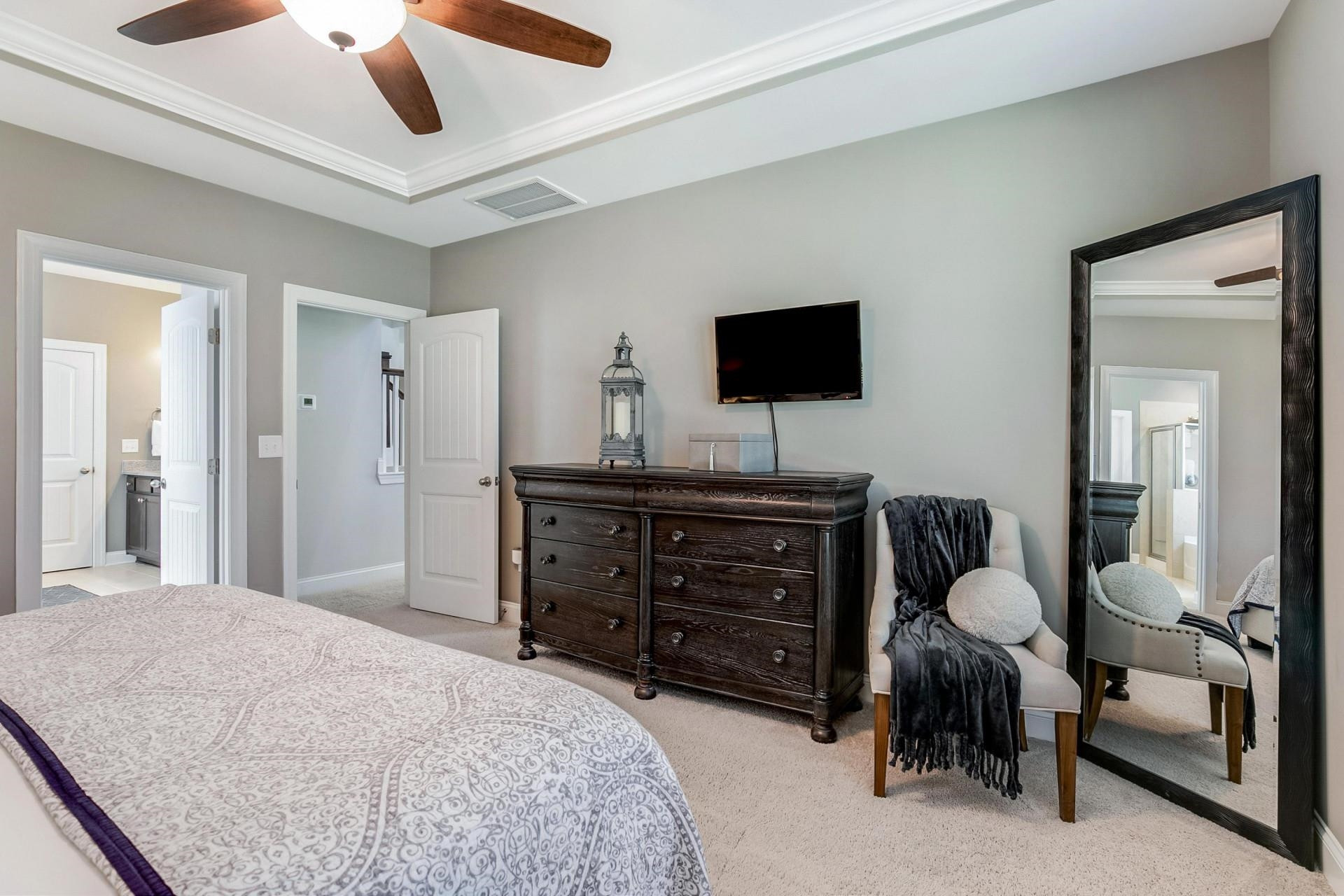 1016 Capstone Drive Durham, NC 27713 - Photo 19 of 50 a bedroom with a bed and a flat screen tv