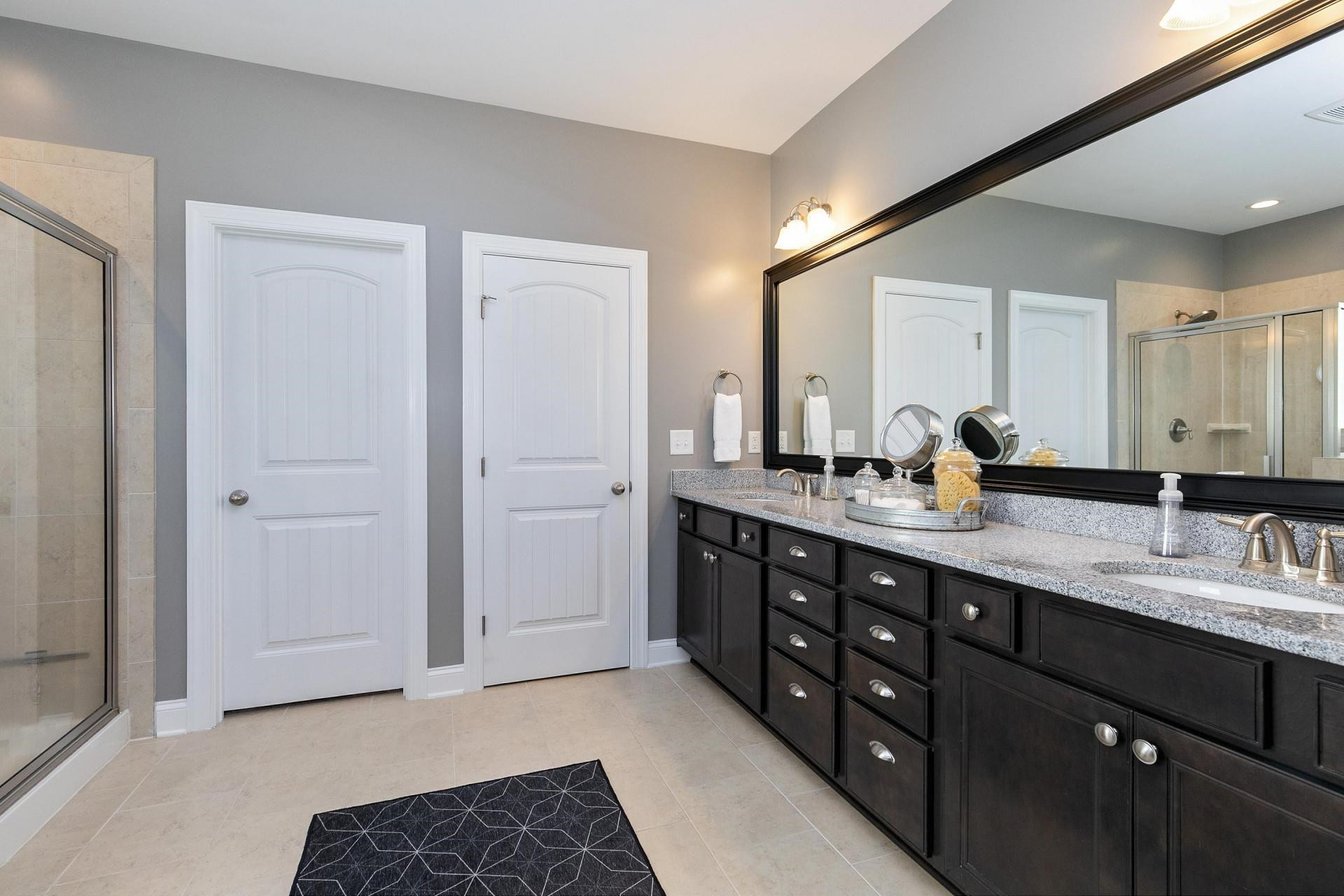 1016 Capstone Drive Durham, NC 27713 - Photo 20 of 50 a spacious bathroom with a double vanity sink double and a mirror