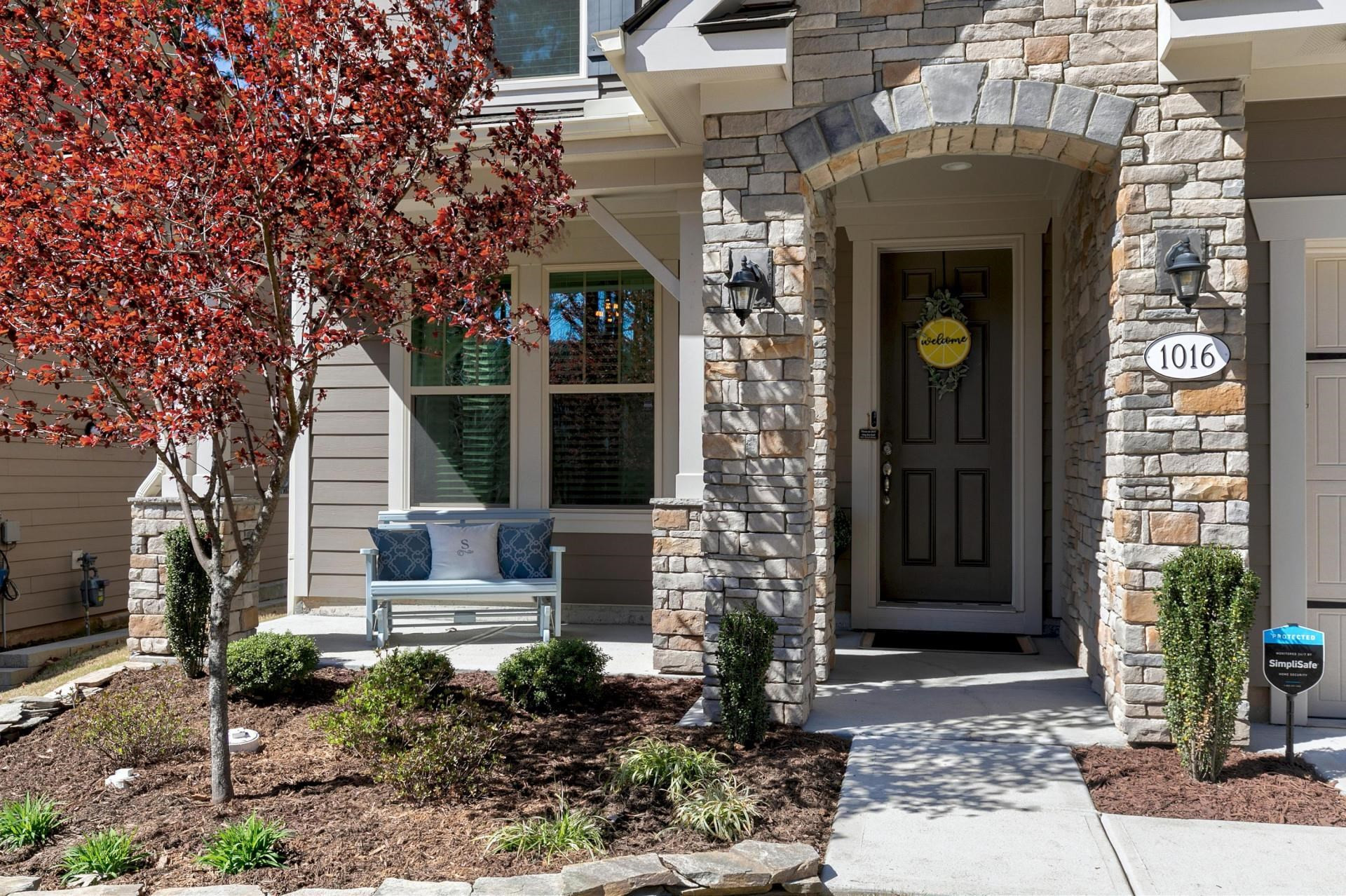 1016 Capstone Drive Durham, NC 27713 - Photo 2 of 50 a front view of a house with garden