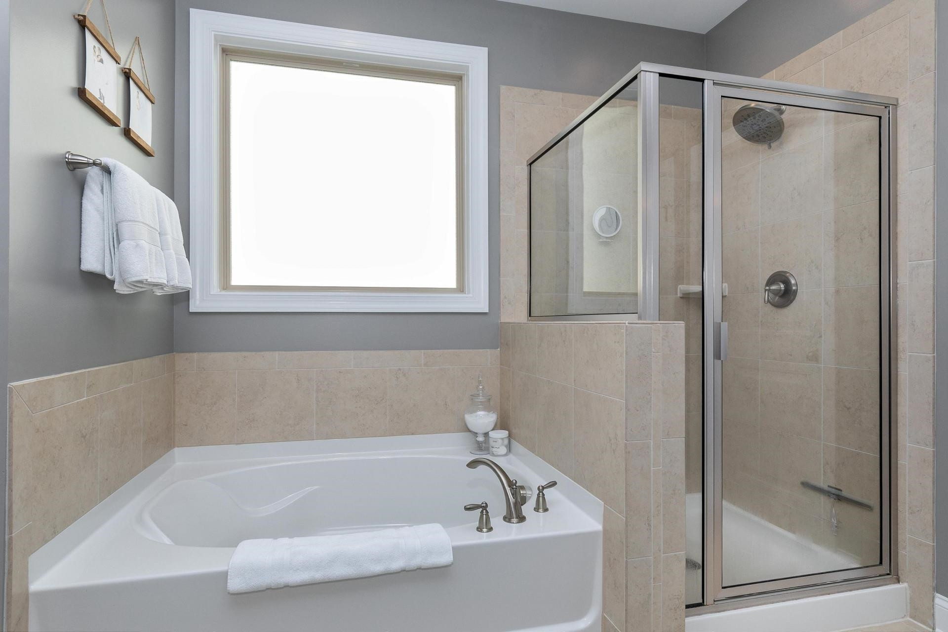 1016 Capstone Drive Durham, NC 27713 - Photo 21 of 50 a white bath tub sitting next to a shower