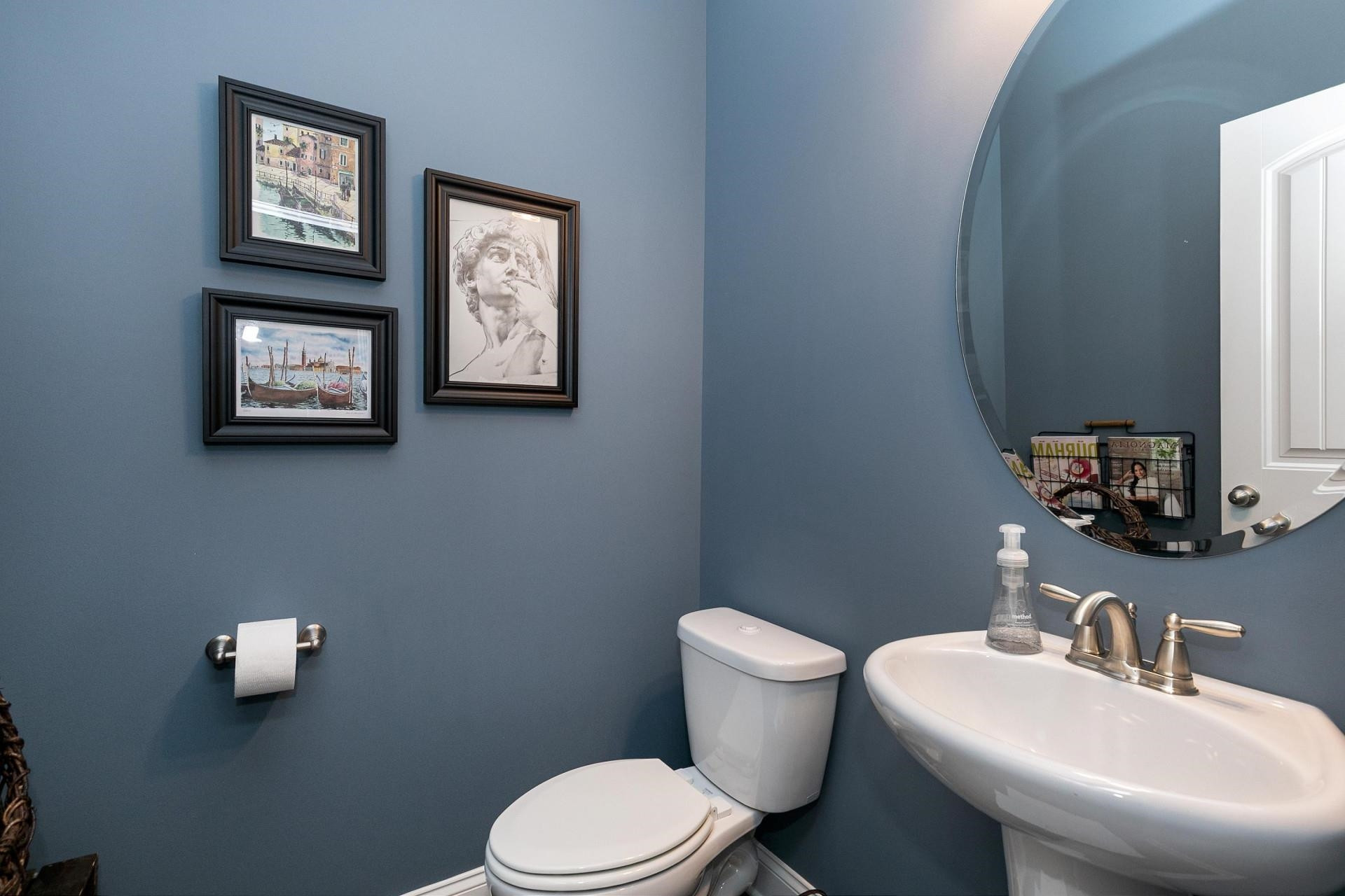 1016 Capstone Drive Durham, NC 27713 - Photo 22 of 50 a bathroom with a toilet a sink and mirror