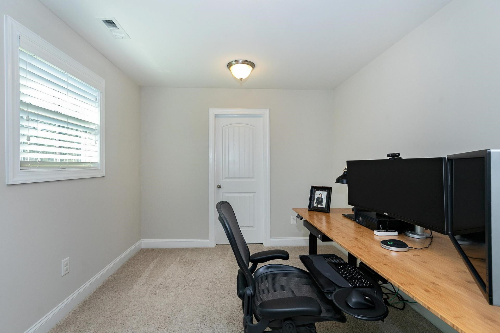 1016 Capstone Drive Durham, NC 27713 - Photo 29 of 50 a view of a workspace with furniture and a window