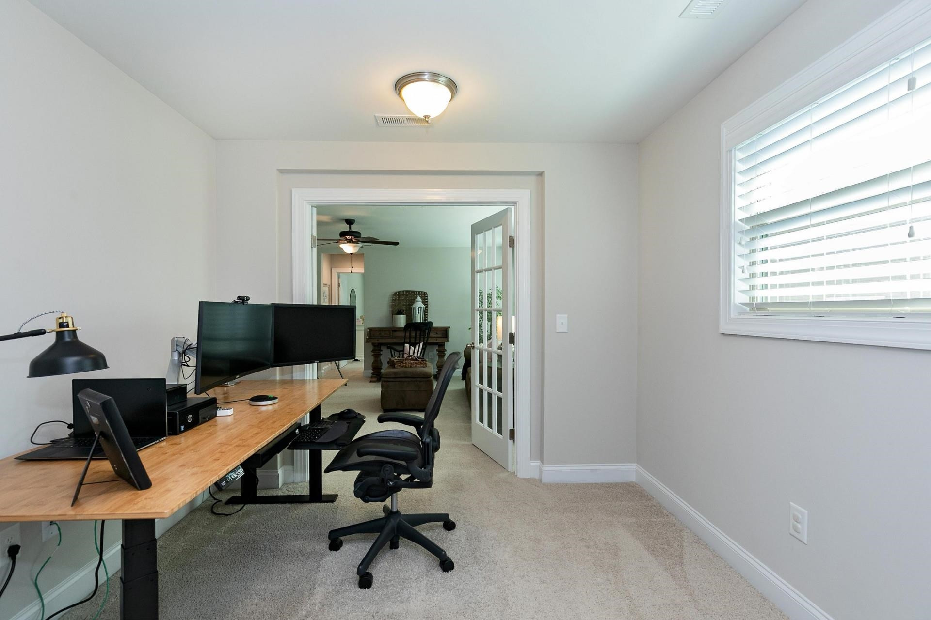 1016 Capstone Drive Durham, NC 27713 - Photo 30 of 50 a view of a workspace with furniture and a window