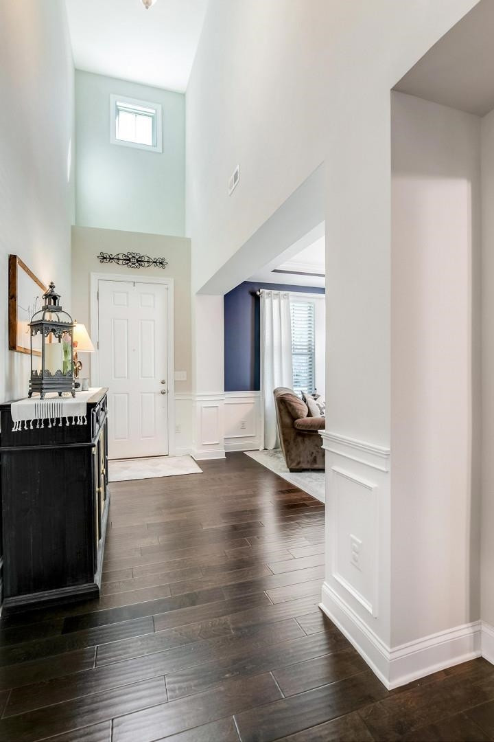 1016 Capstone Drive Durham, NC 27713 - Photo 4 of 50 a view of a livingroom with furniture hardwood floor and a ceiling fan