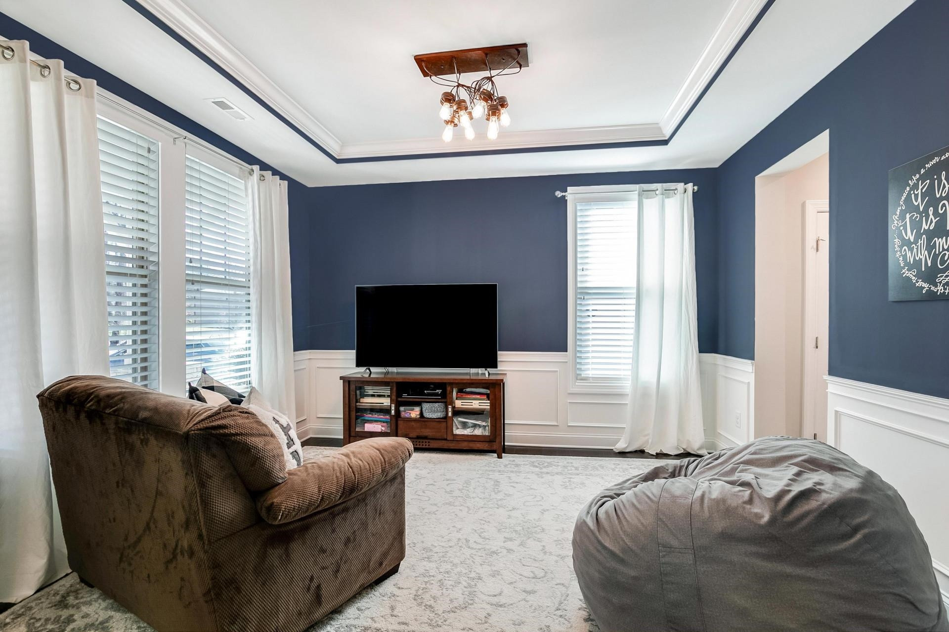 1016 Capstone Drive Durham, NC 27713 - Photo 5 of 50 a living room with furniture and a flat screen tv