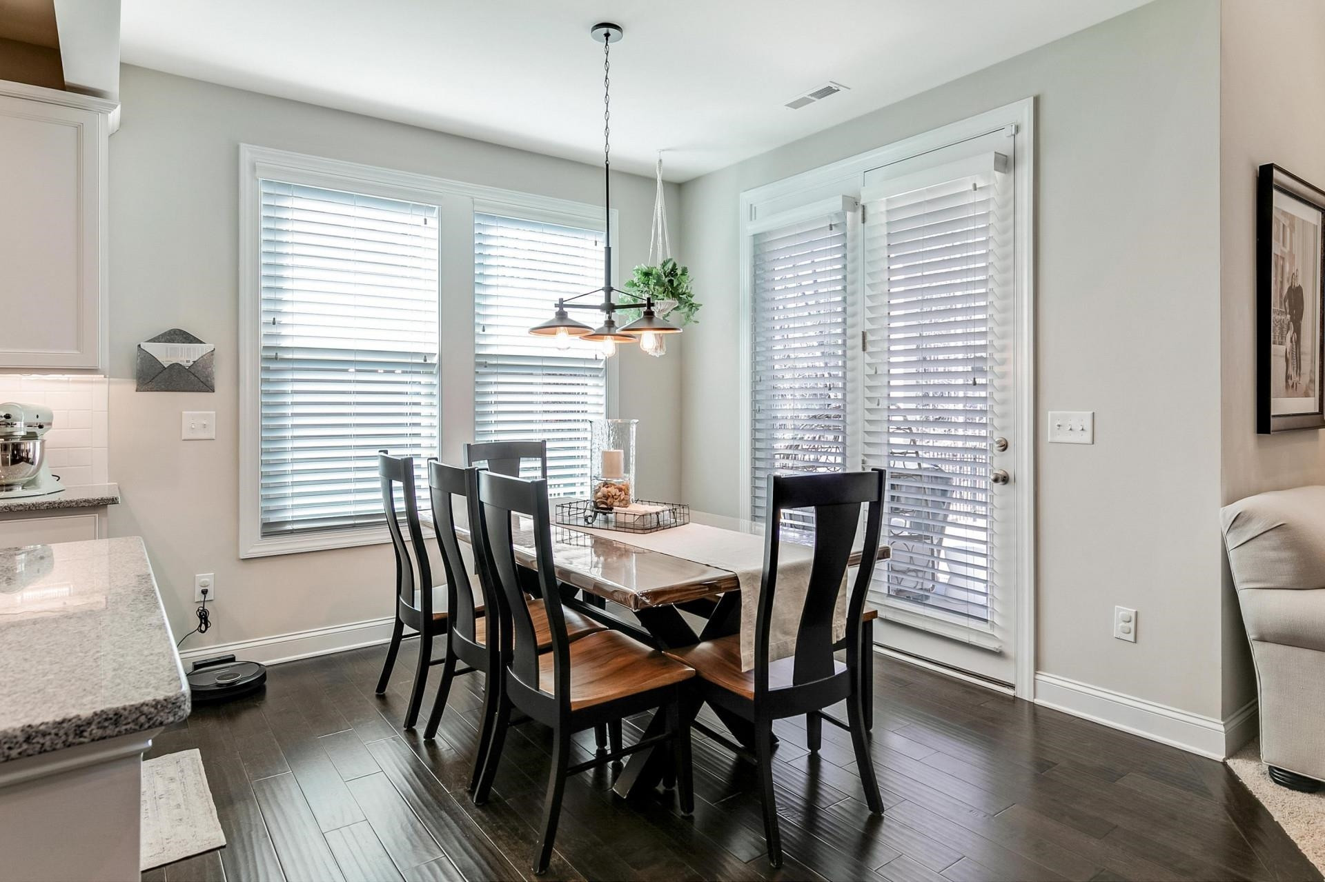 1016 Capstone Drive Durham, NC 27713 - Photo 10 of 50 a view of a dining room with furniture window and wooden floor