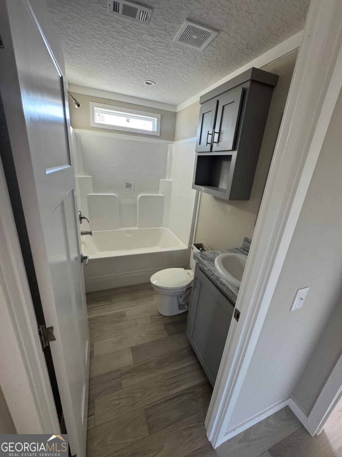 70 Long Leaf Road Hazlehurst, GA 31539 - Photo 11 of 17 a bathroom with a toilet and a shower
