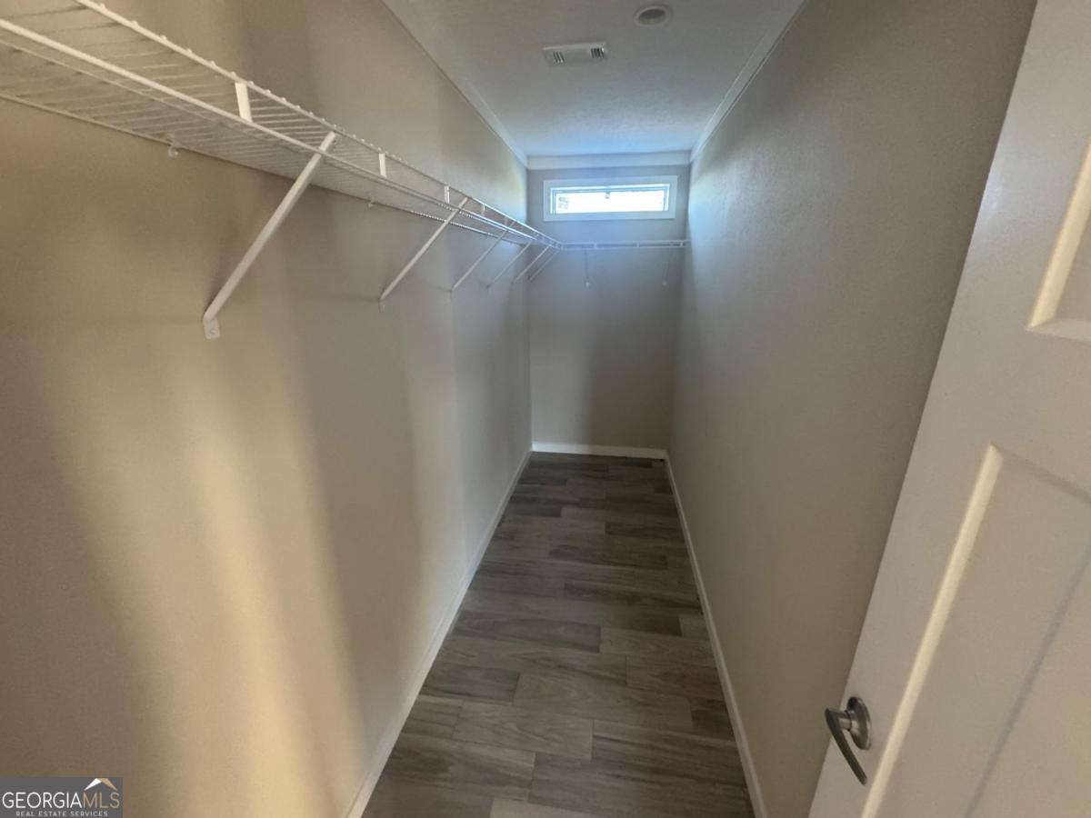 70 Long Leaf Road Hazlehurst, GA 31539 - Photo 14 of 17 a view of a hallway with wooden floor