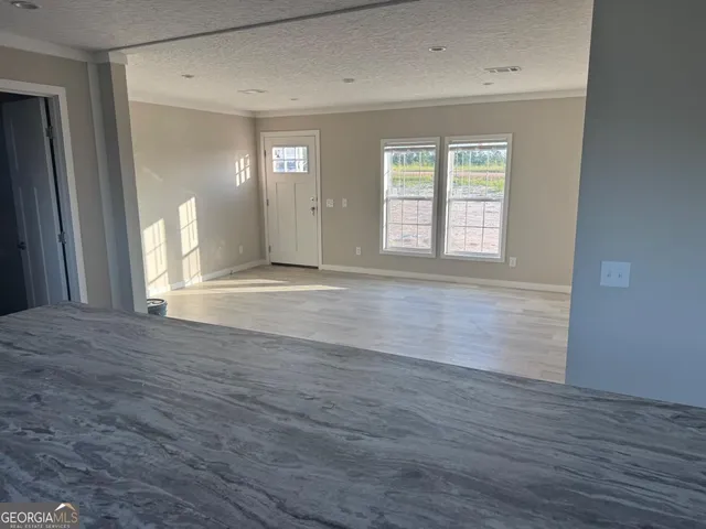 a kitchen with a refrigerator and cabinets