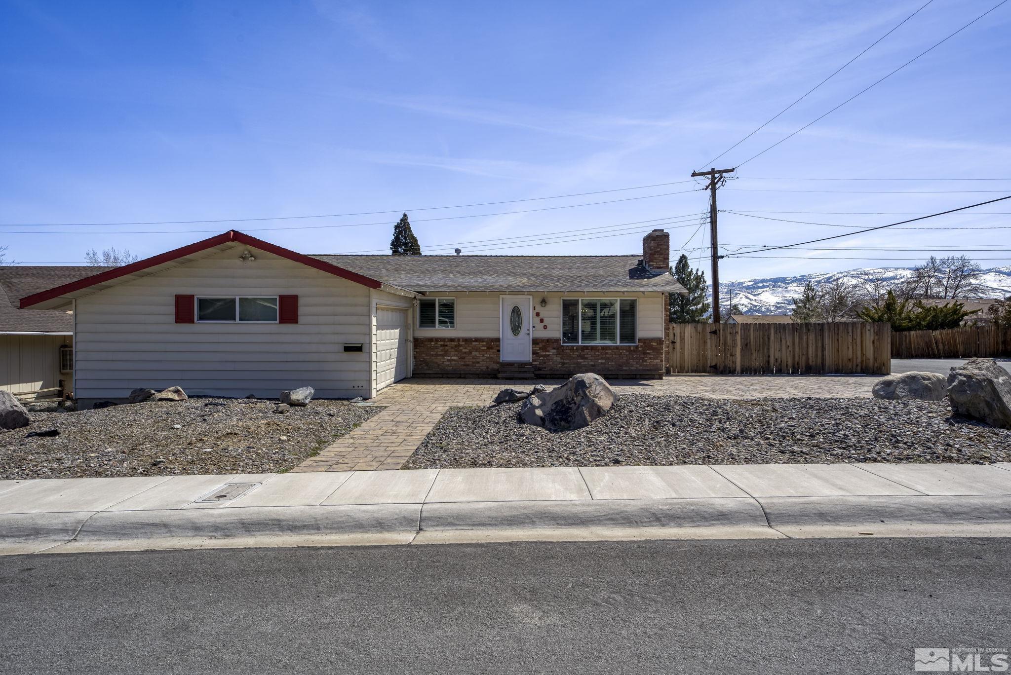 1890 Carlin Street Reno, NV 89503 - Photo 1 of 40 a front view of a house with a garden