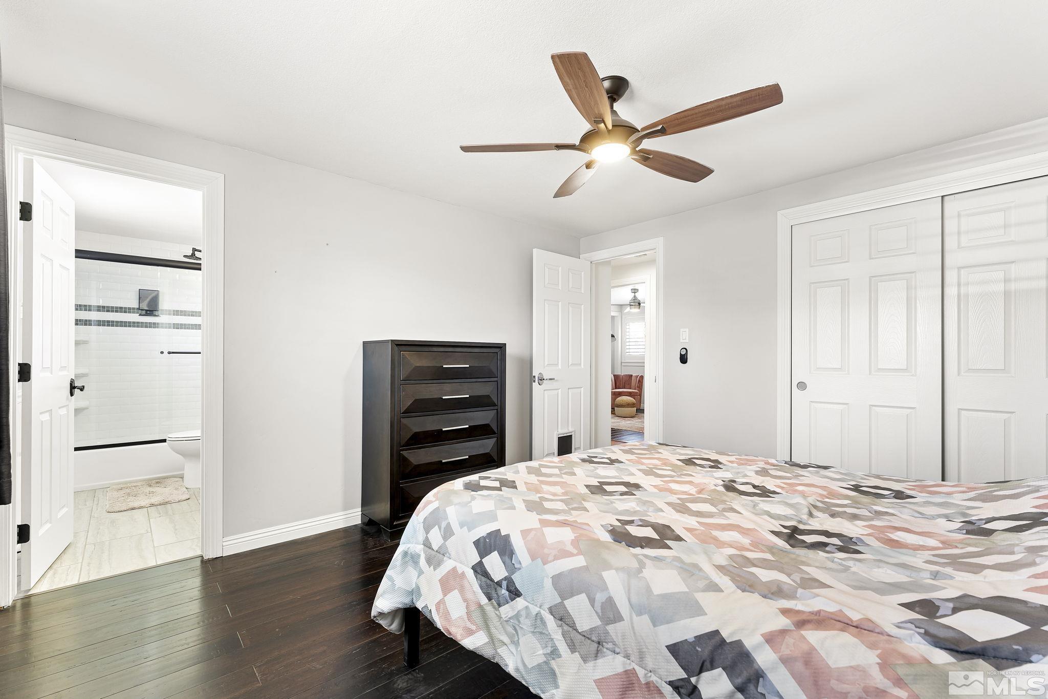 1890 Carlin Street Reno, NV 89503 - Photo 14 of 40 a bedroom with a bed and a ceiling fan