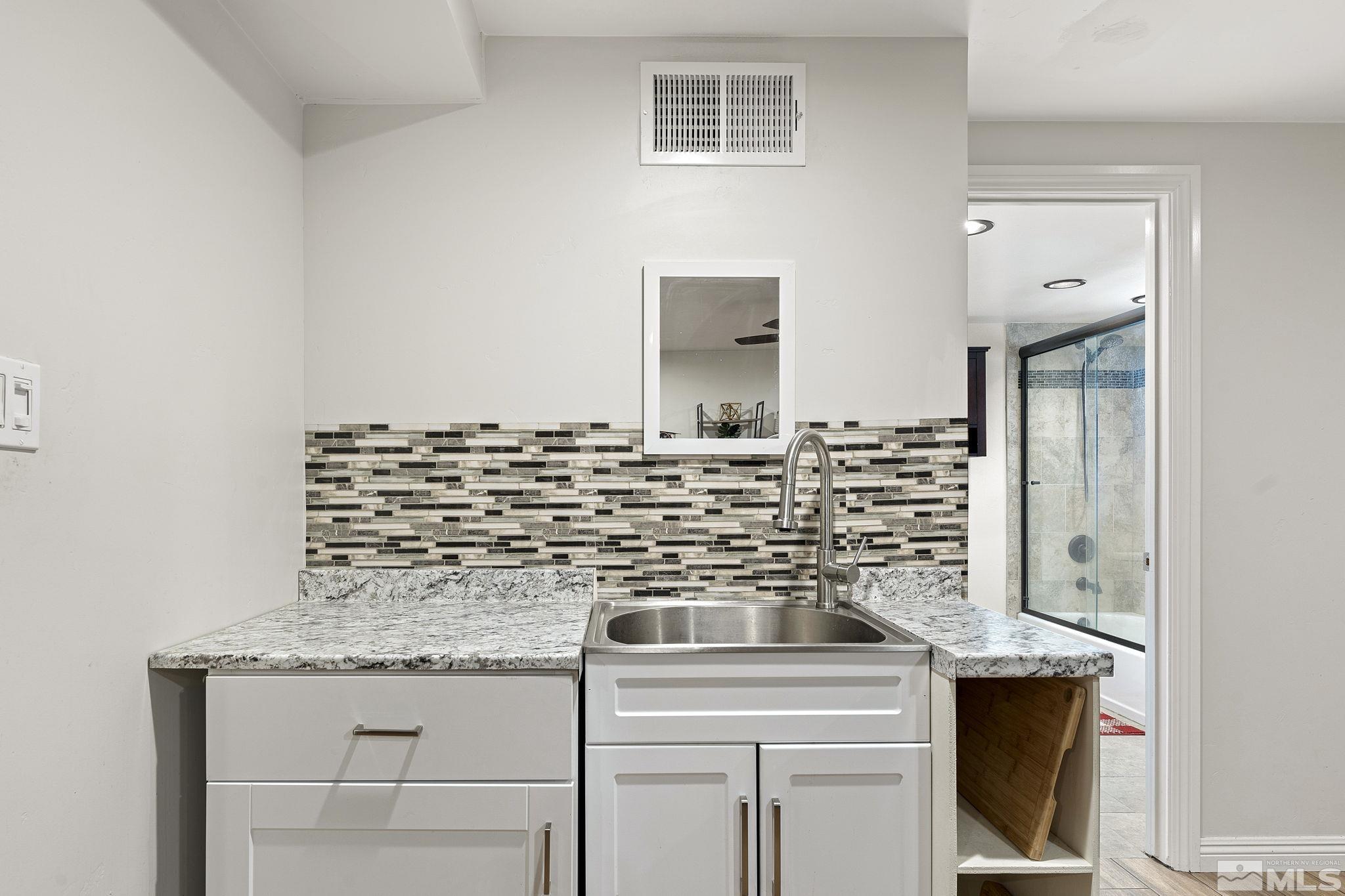1890 Carlin Street Reno, NV 89503 - Photo 23 of 40 a kitchen with a sink and cabinets