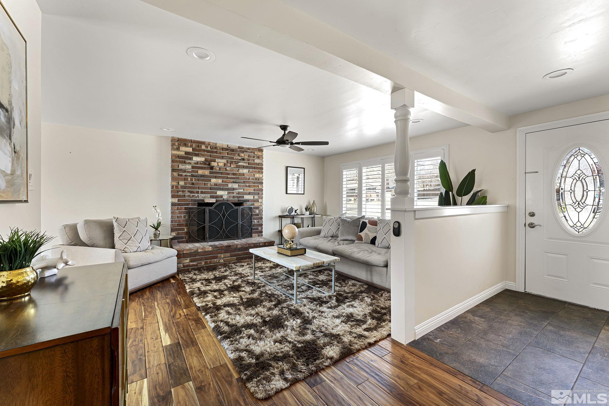 1890 Carlin Street Reno, NV 89503 - Photo 3 of 40 a living room with furniture and a fireplace