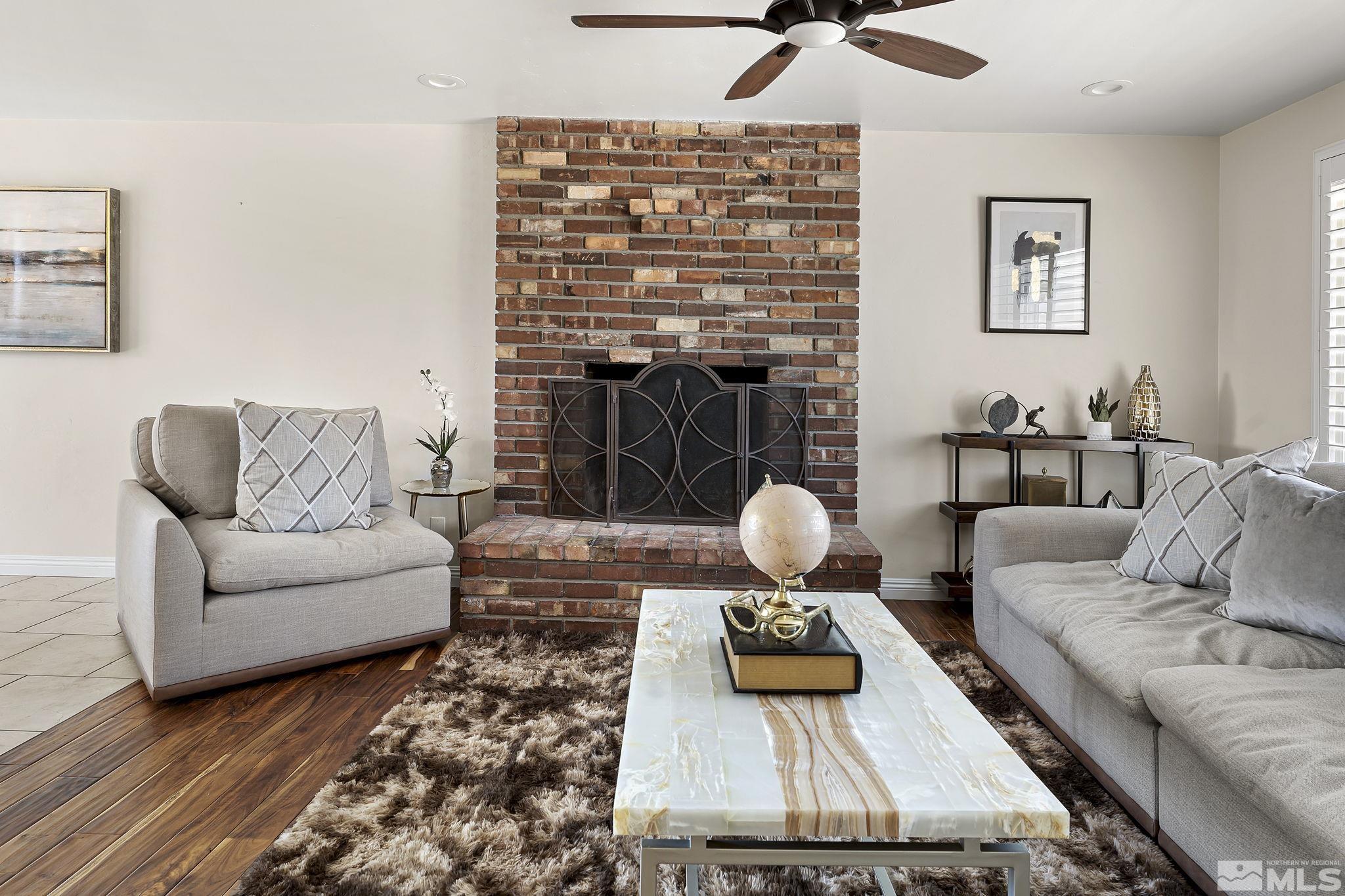 1890 Carlin Street Reno, NV 89503 - Photo 4 of 40 a living room with furniture and a fireplace