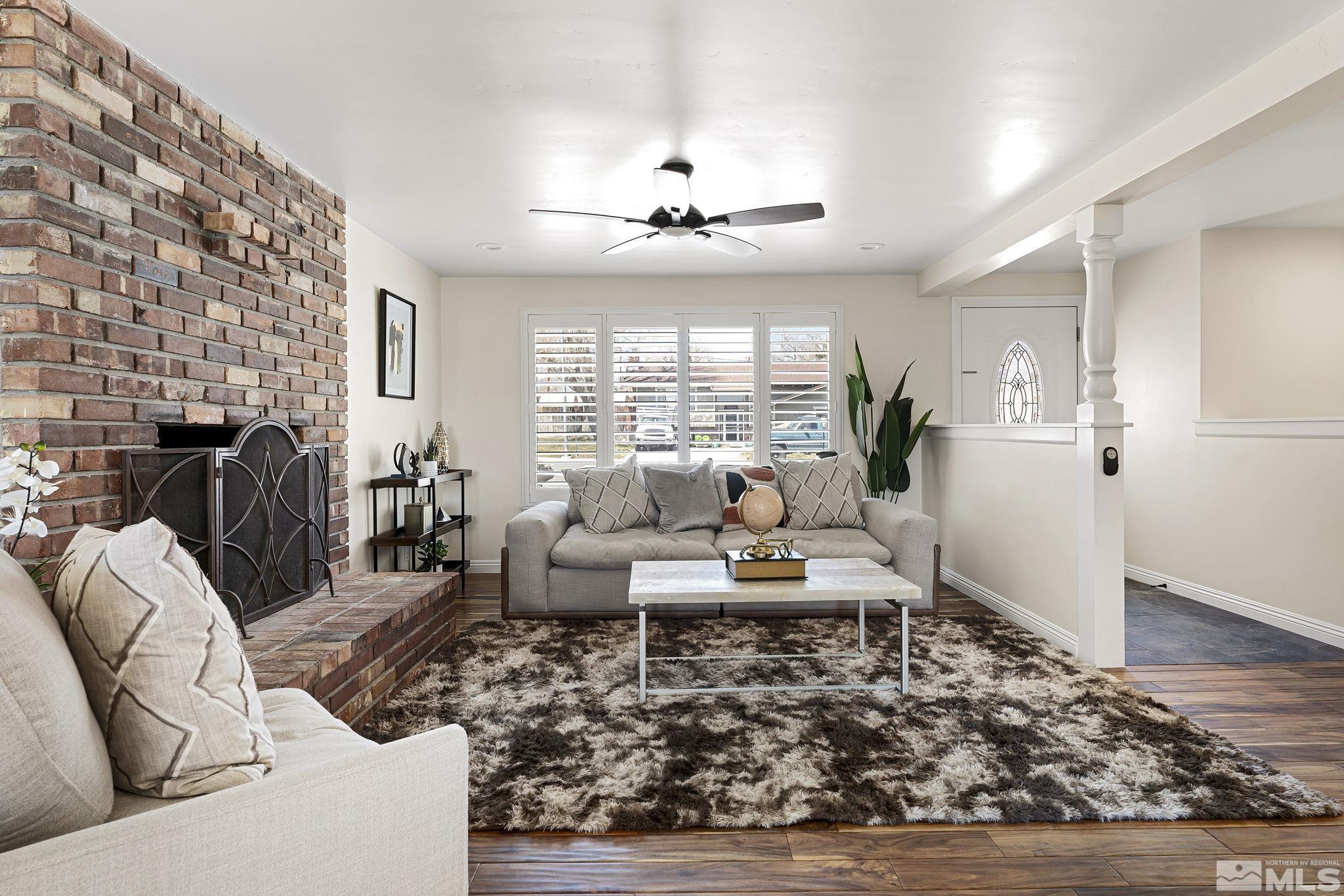 1890 Carlin Street Reno, NV 89503 - Photo 5 of 40 a living room with furniture and a fireplace