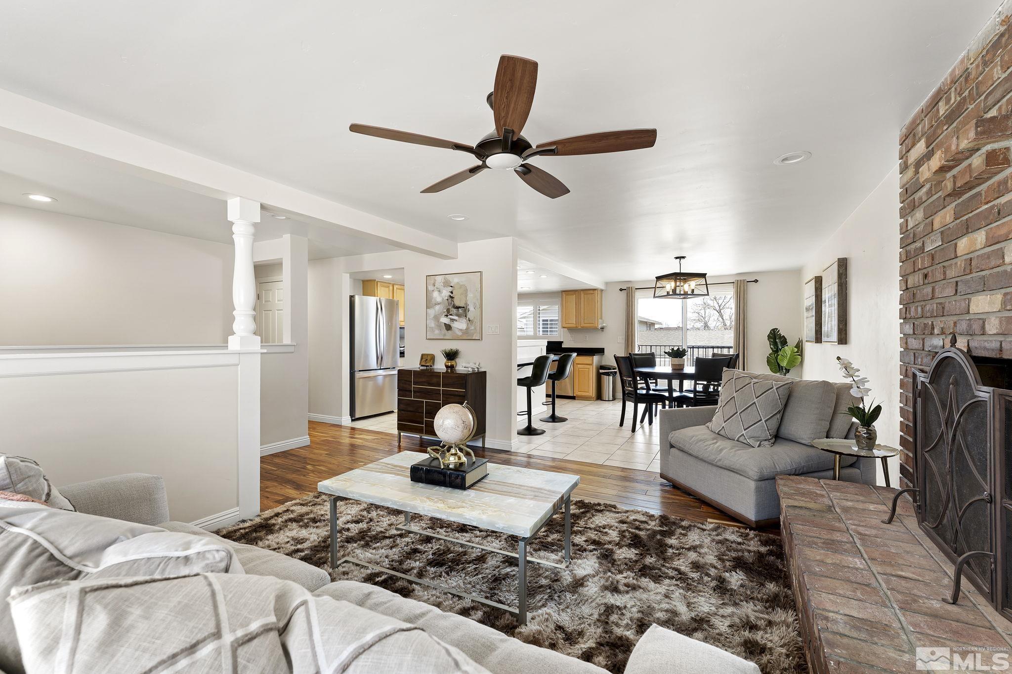 1890 Carlin Street Reno, NV 89503 - Photo 7 of 40 a living room with furniture and a chandelier