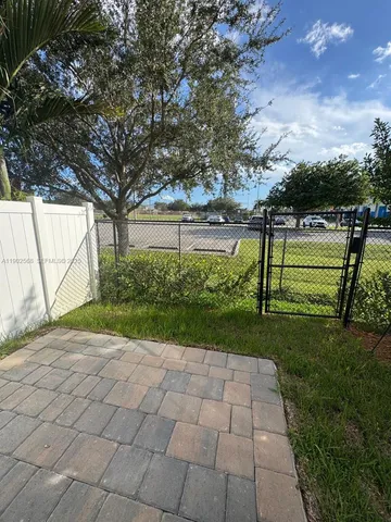 a view of a back yard from a patio