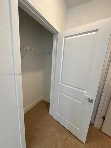 a view of a hallway view with staircase