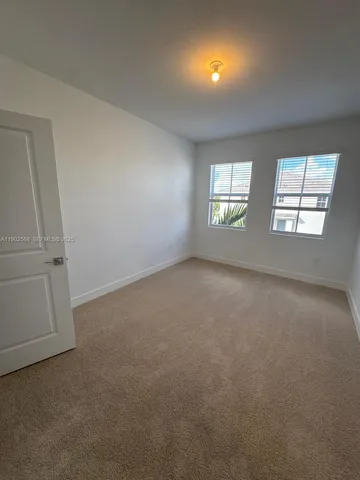 a bathroom with a double vanity sink mirror double and shower