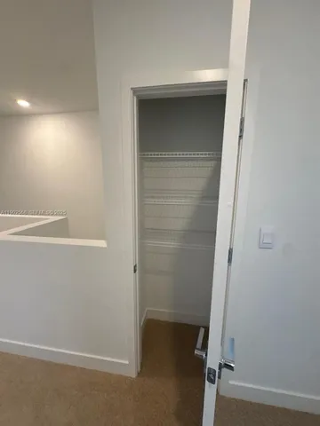 a spacious bathroom with a shower sink and mirror