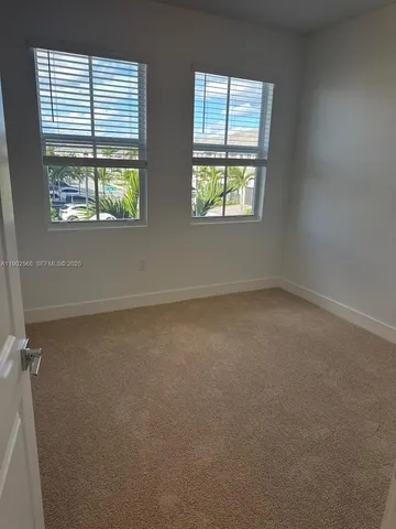 a room with gym equipment and a large window