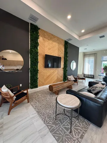 a view of a house with a yard and sitting area