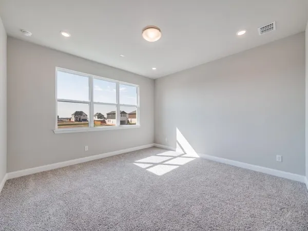 a view of wooden floor and windows in a room