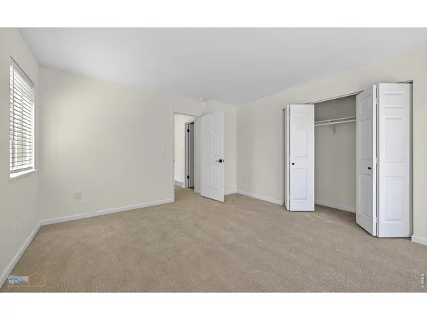 a big room with closet and a bathroom