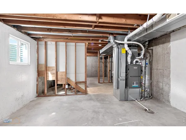 a living room with a large bed and a large window