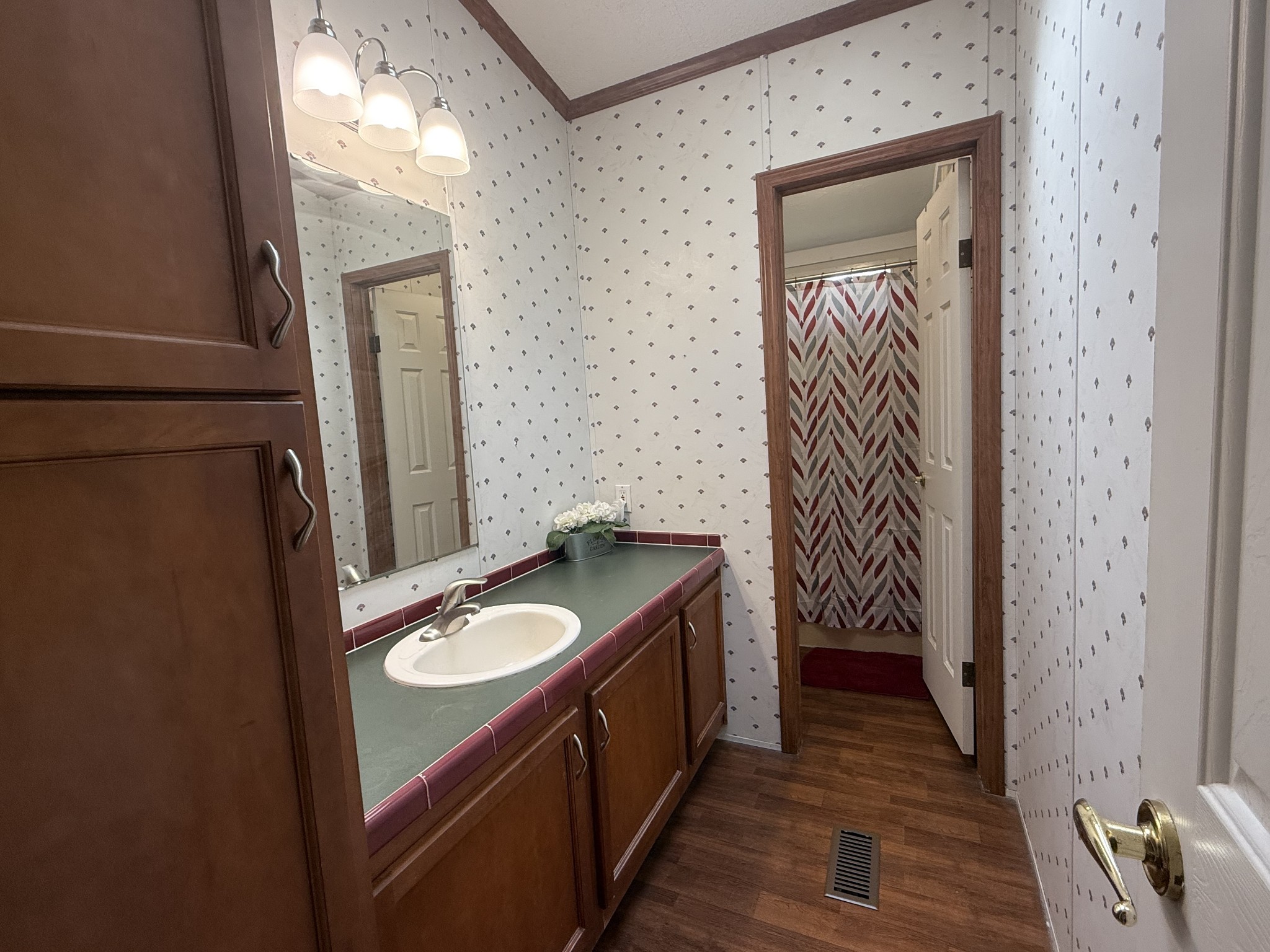 501 Post Road Michie, TN 38357 - Photo 20 of 21 a bathroom with a granite countertop sink and a mirror