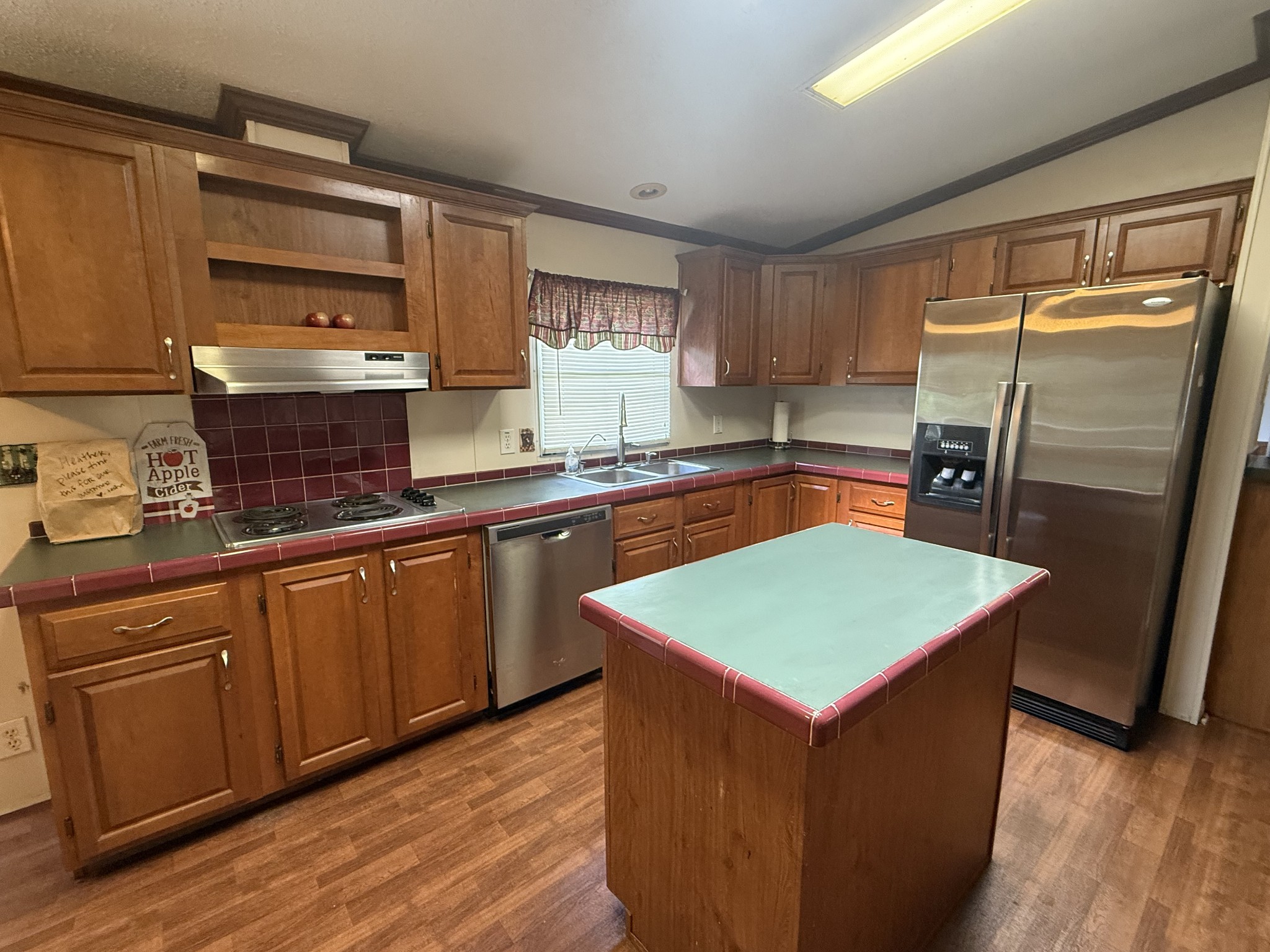 501 Post Road Michie, TN 38357 - Photo 9 of 21 a kitchen with stainless steel appliances granite countertop a sink stove and refrigerator