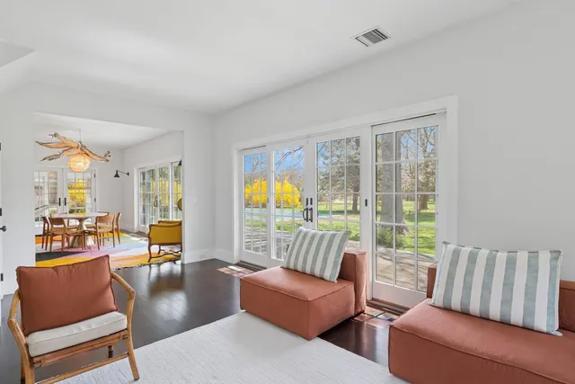 a bathroom with a sink mirror vanity and toilet