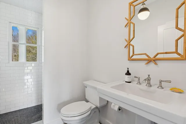 a bathroom with a tub and a sink