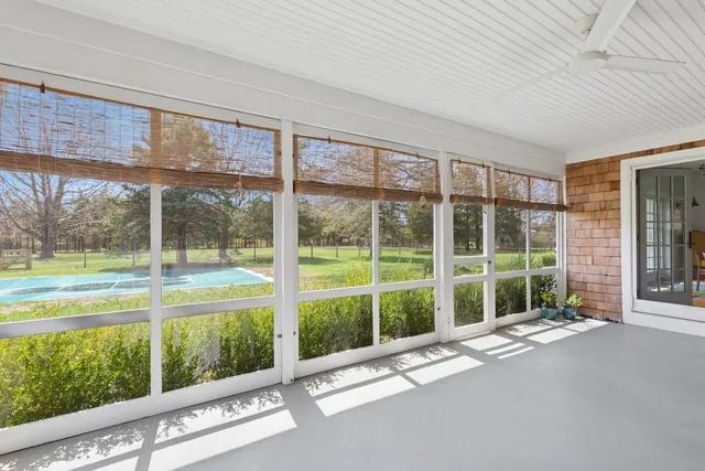 an aerial view of a houses with a yard