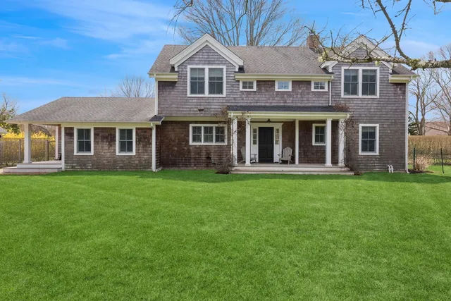 a view of a park with large trees