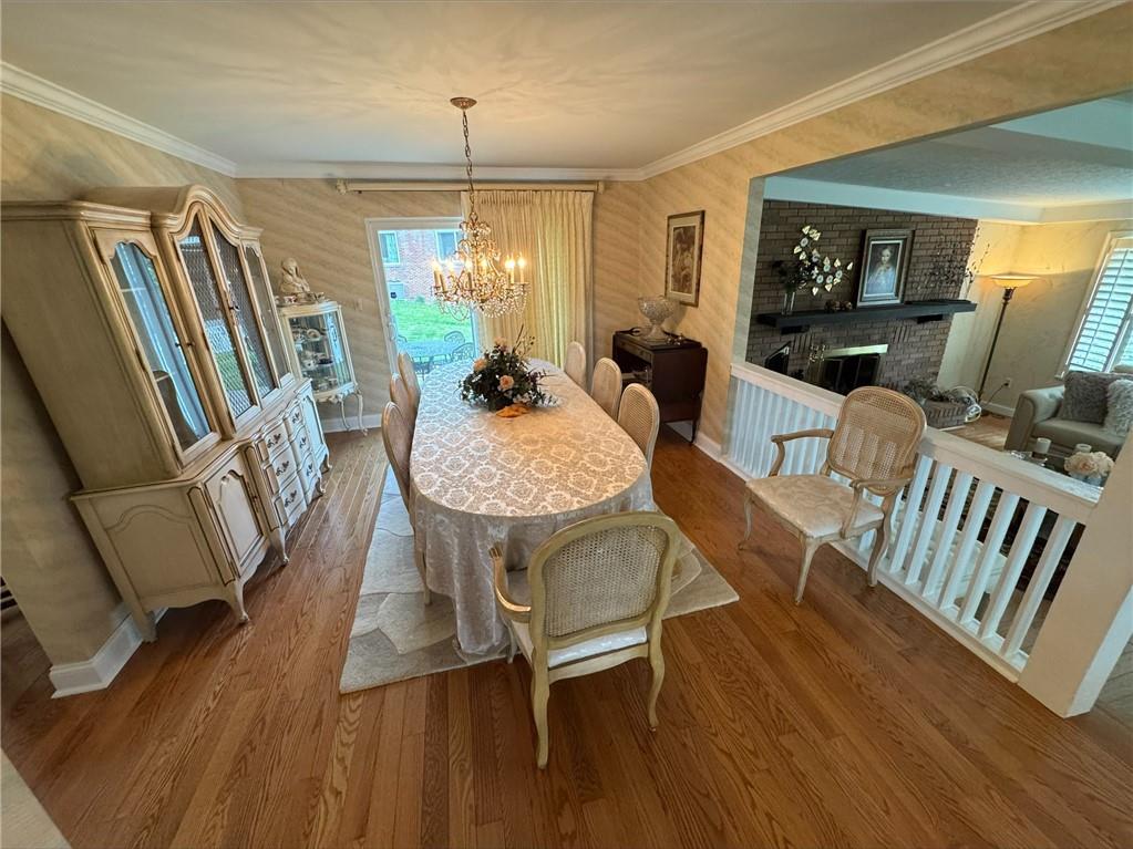 1313 Cross Street Rostraver Township, PA 15012 - Photo 3 of 49 a view of a dining room with furniture window and wooden floor