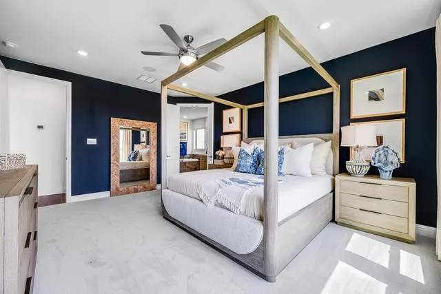 a spacious bathroom with a double vanity sink a mirror a bathtub and a window