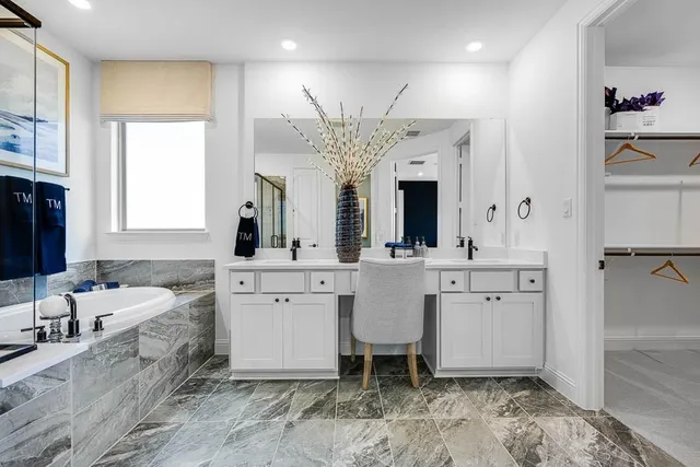 a bedroom with a bed and a lamp