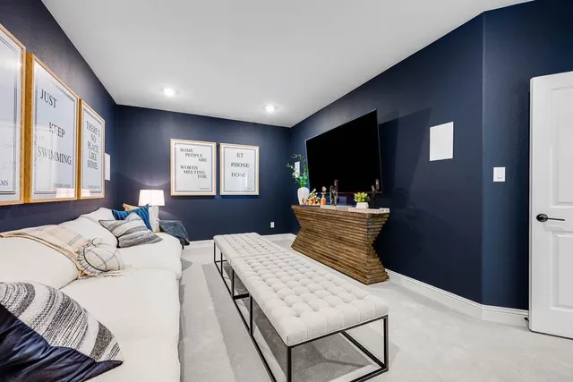 a living room with furniture and white walls