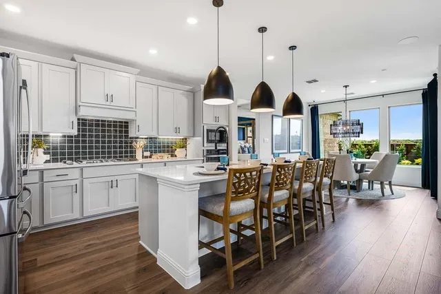 a bed room with a bed and a chandelier