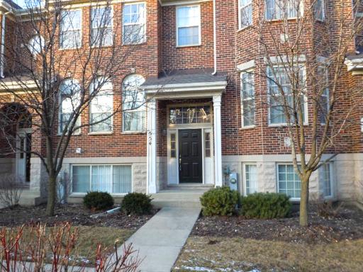 554 Prestwick Lane Wheeling, IL 60090 - Photo 1 of 16 a front view of a house with garden