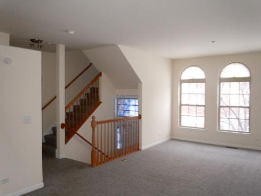 554 Prestwick Lane Wheeling, IL 60090 - Photo 2 of 16 a view of an entryway with staircase