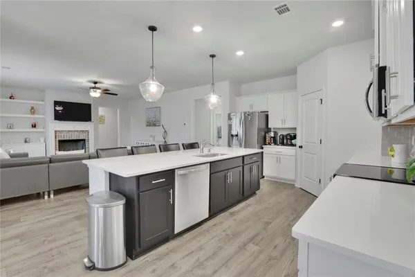 a kitchen with counter top space and sink