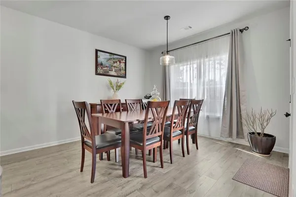 a view of a dining room with furniture window and outside view