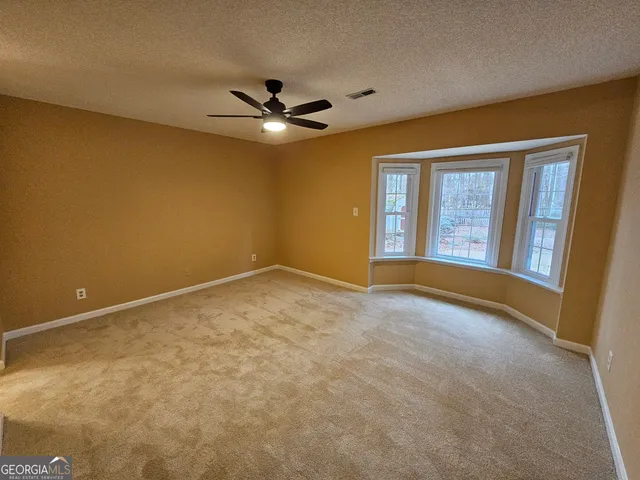a bathroom with a bath tub and a shower
