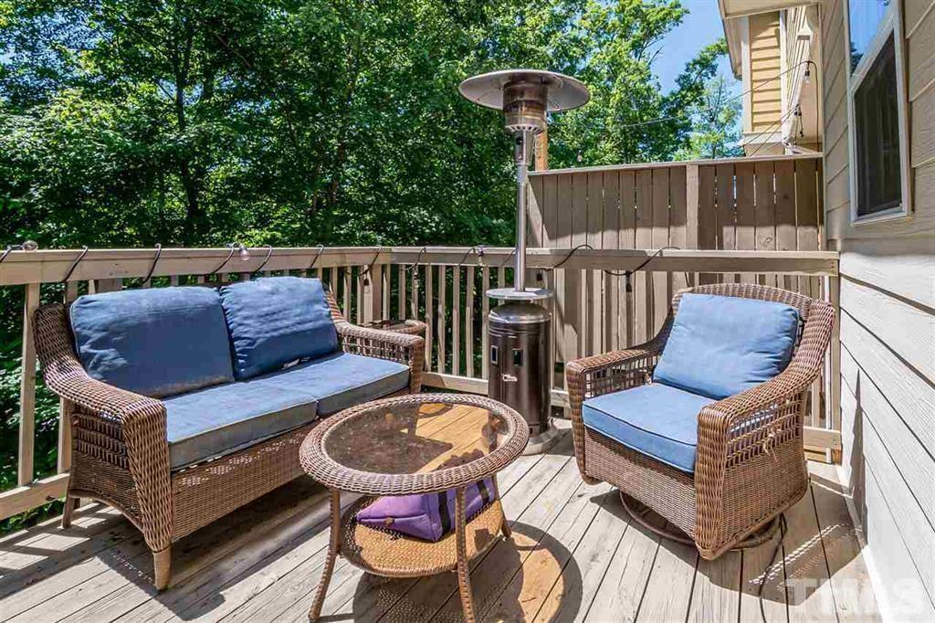 2800 Bedford Green Drive, Unit 106 Raleigh, NC 27604 - Photo 11 of 26 a view of balcony with wooden floor and outdoor seating
