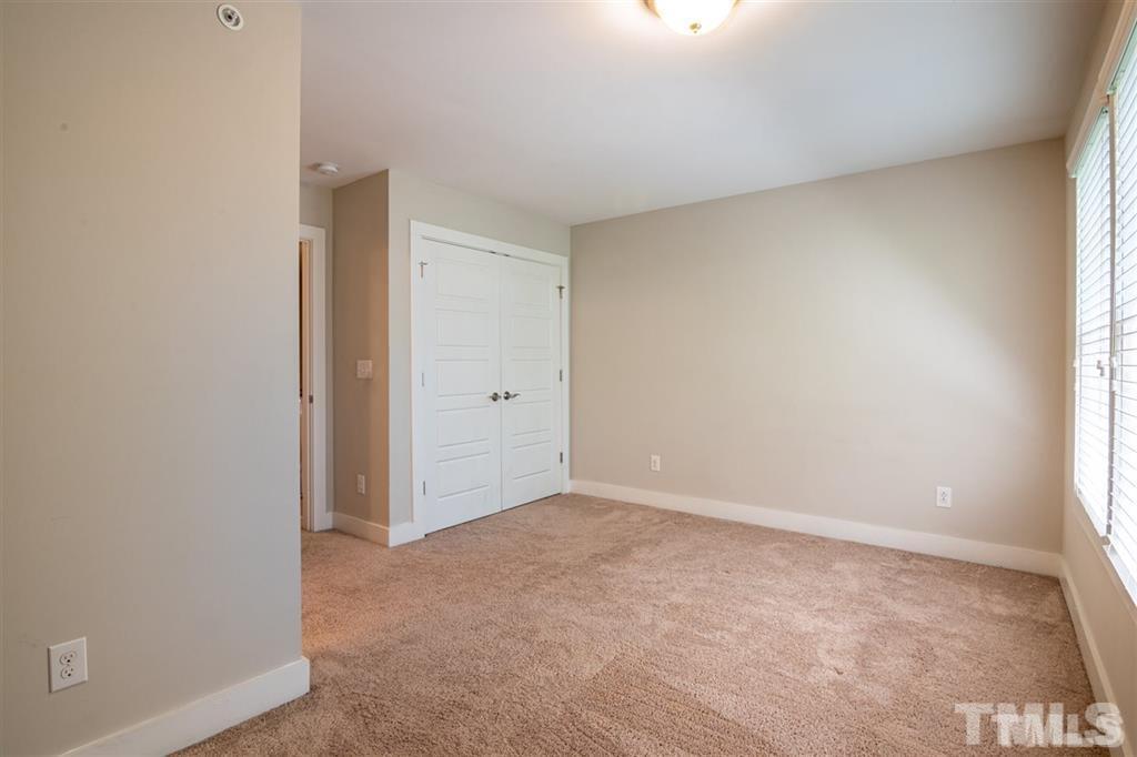 2800 Bedford Green Drive, Unit 106 Raleigh, NC 27604 - Photo 23 of 26 a view of an empty room and window