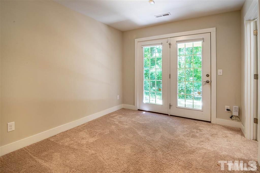 2800 Bedford Green Drive, Unit 106 Raleigh, NC 27604 - Photo 24 of 26 a view of an empty room with a window