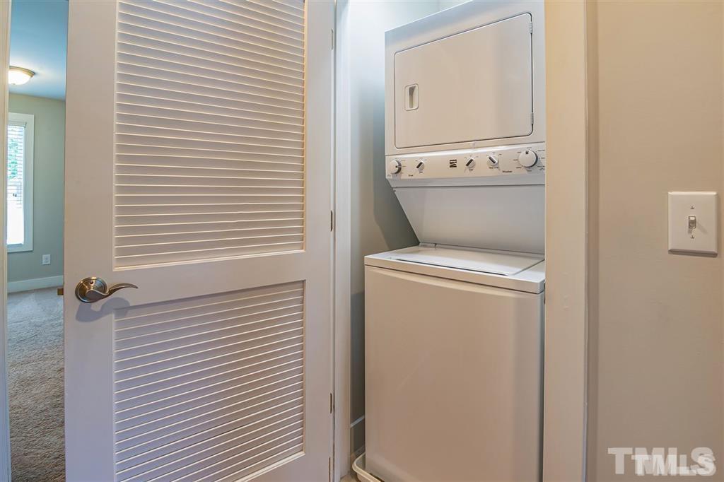 2800 Bedford Green Drive, Unit 106 Raleigh, NC 27604 - Photo 25 of 26 a utility room with dryer and washer