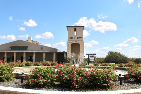 94 Arch Ray Loop, Unit 94 Fredericksburg, TX 78624 - Photo 2 of 4 a front view of a house with a yard